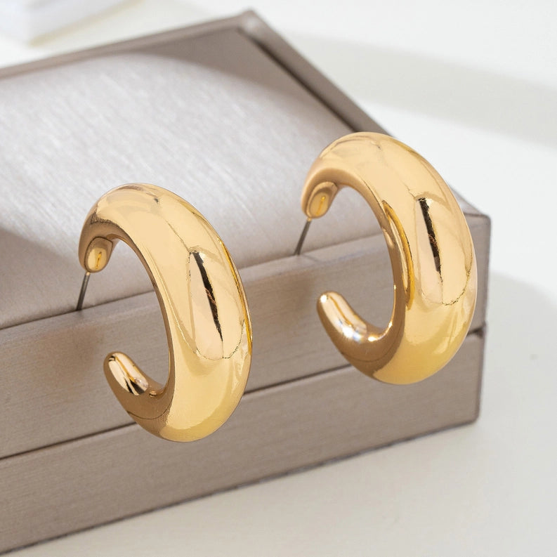 Tapered Gold Tone Crescent Hoop Earrings
