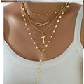 Layered Gold & Pearl Cross Statement Necklace